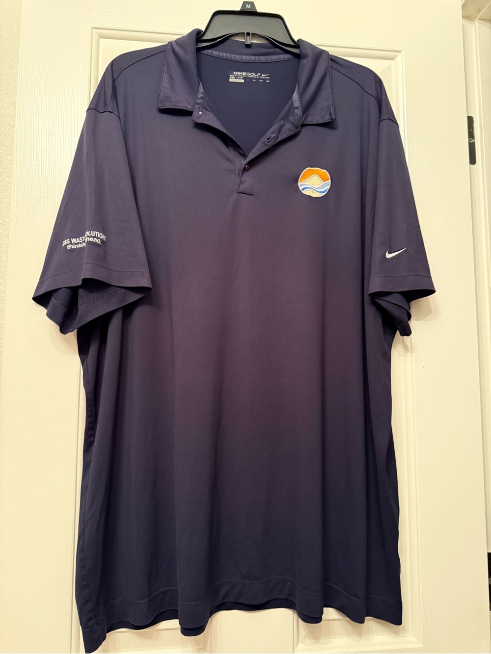 Nike Men’s Navy Polo with Orange & White Wave Logo